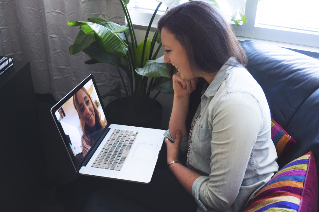 Girls talking on laptop